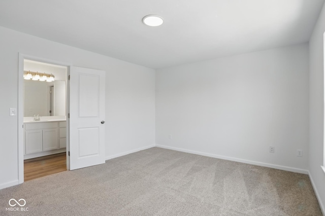 3931 Wren Dr, Brownsburg, IN 46112 - unfurnished bedroom with carpet floors, a sink, baseboards, and ensuite bathroom