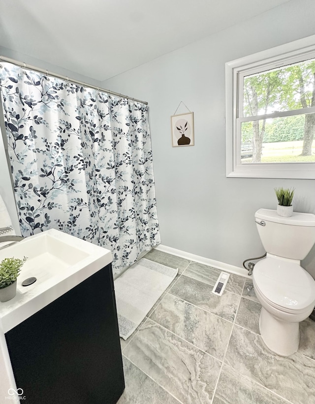 3594 Roland Dr, Kingman, IN 47952 - full bath with toilet, vanity, baseboards, and a shower with shower curtain