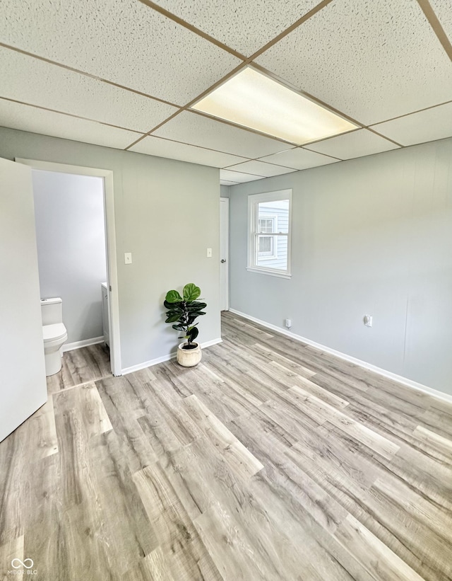 3594 Roland Dr, Kingman, IN 47952 - unfurnished room with wood finished floors, baseboards, and a drop ceiling