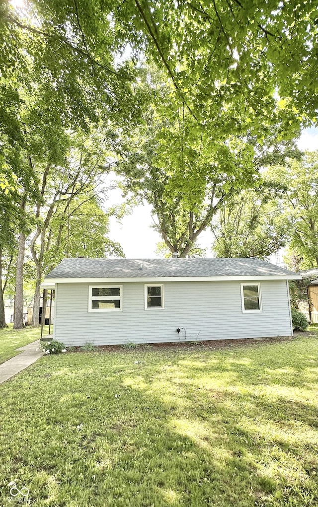 3594 Roland Dr, Kingman, IN 47952 - view of side of home featuring a lawn