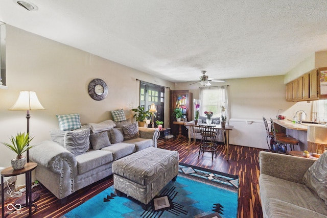 9130 E 18th St, Indianapolis, IN 46229 - living room with wood finished floors, ceiling fan, and a textured ceiling