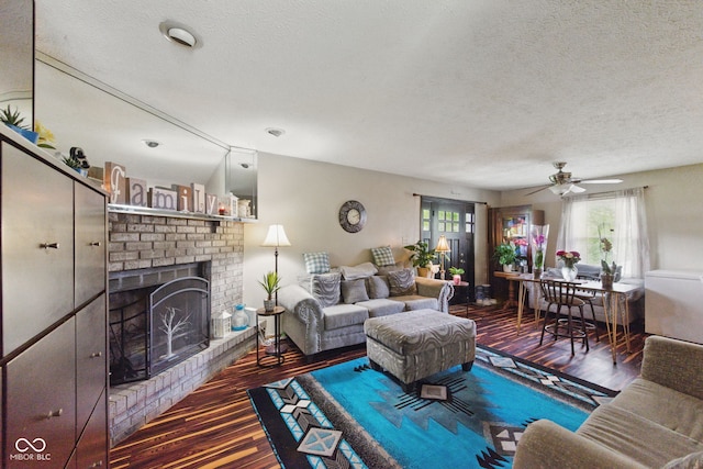 9130 E 18th St, Indianapolis, IN 46229 - living room with healthy amount of natural light, wood finished floors, a textured ceiling, and a fireplace