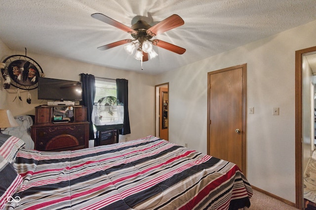 9130 E 18th St, Indianapolis, IN 46229 - carpeted bedroom with a textured ceiling, a ceiling fan, and baseboards