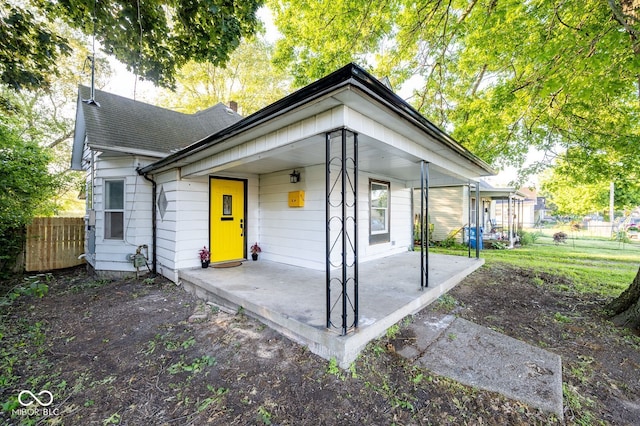 214 S Mcilroy Ave, West Terre Haute, IN 47885 - back of property with a porch