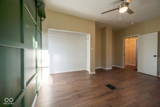 214 S Mcilroy Ave, West Terre Haute, IN 47885 - unfurnished bedroom featuring wood finished floors, baseboards, and ceiling fan