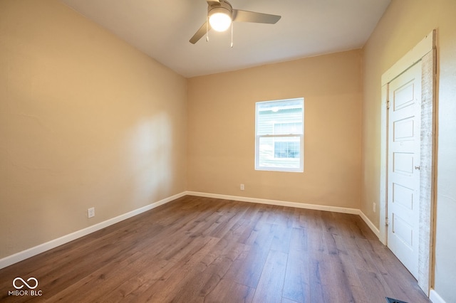 214 S Mcilroy Ave, West Terre Haute, IN 47885 - spare room featuring dark wood finished floors, ceiling fan, and baseboards