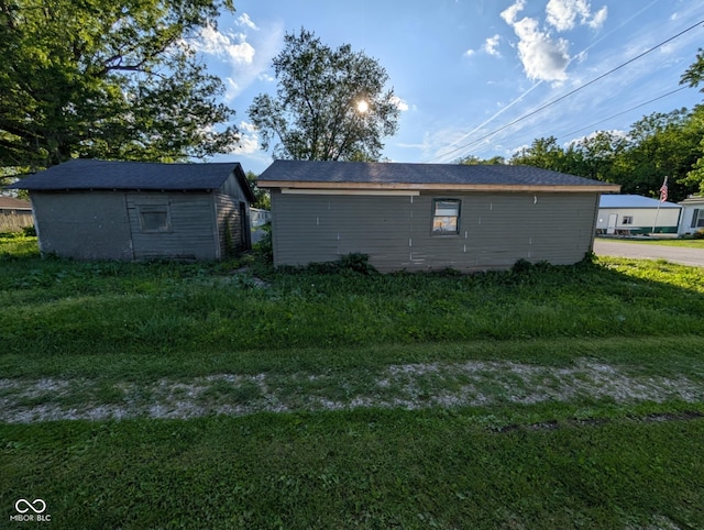 9712 N Price St, Knightsville, IN 47857 - view of home's exterior featuring an outbuilding and a lawn