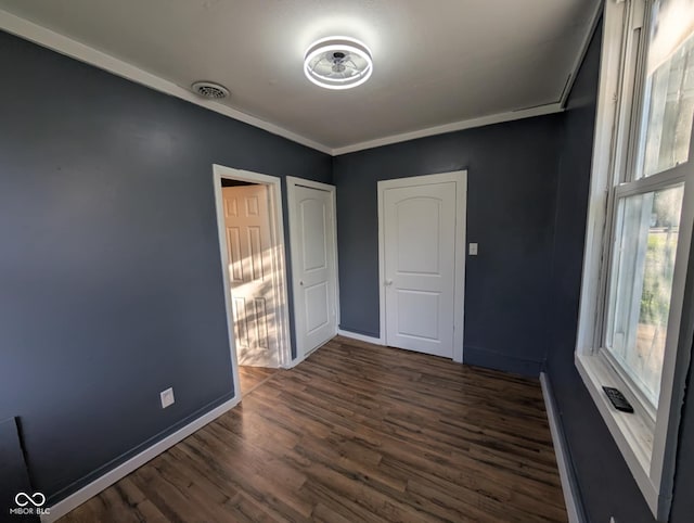 9712 N Price St, Knightsville, IN 47857 - unfurnished bedroom with dark wood-type flooring and baseboards