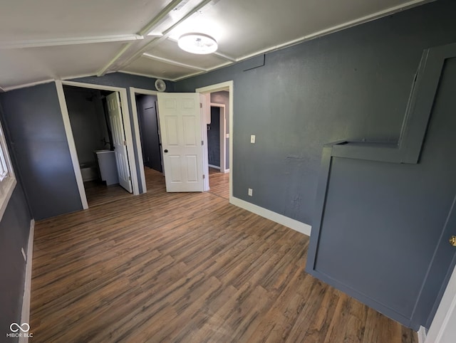9712 N Price St, Knightsville, IN 47857 - unfurnished bedroom with wood finished floors, lofted ceiling, and baseboards