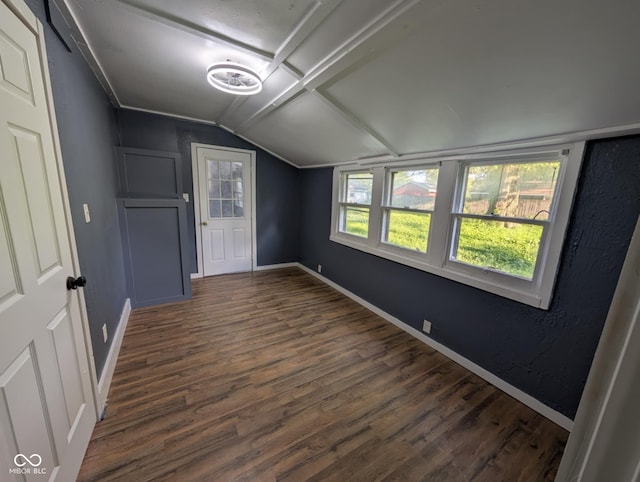 9712 N Price St, Knightsville, IN 47857 - unfurnished room with lofted ceiling, dark wood finished floors, and baseboards