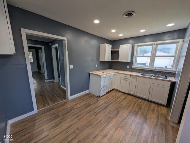 9712 N Price St, Knightsville, IN 47857 - kitchen featuring a sink, dark wood-style flooring, baseboards, light countertops, and open shelves