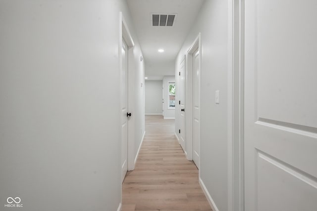 302 Highlawn Ave, Seymour, IN 47274 - hallway featuring light wood-type flooring, baseboards, and recessed lighting