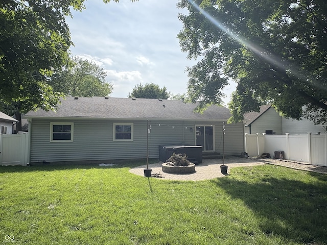 912 Delray Dr, Indianapolis, IN 46241 - rear view of house with a hot tub and a patio