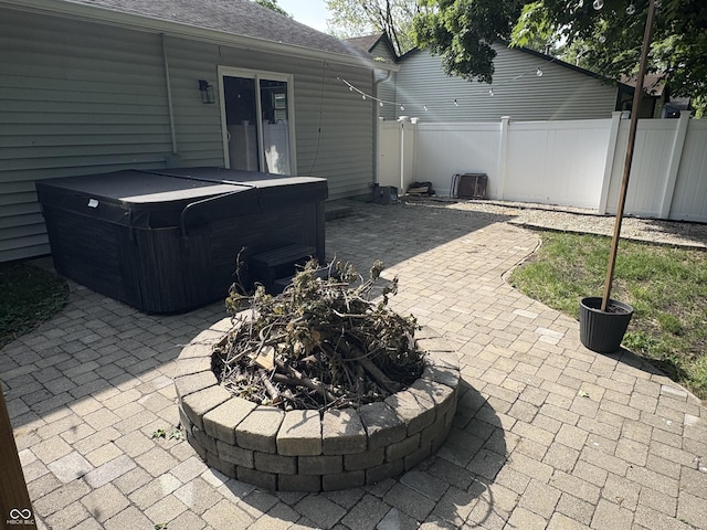 912 Delray Dr, Indianapolis, IN 46241 - view of patio with a hot tub and an outdoor fire pit