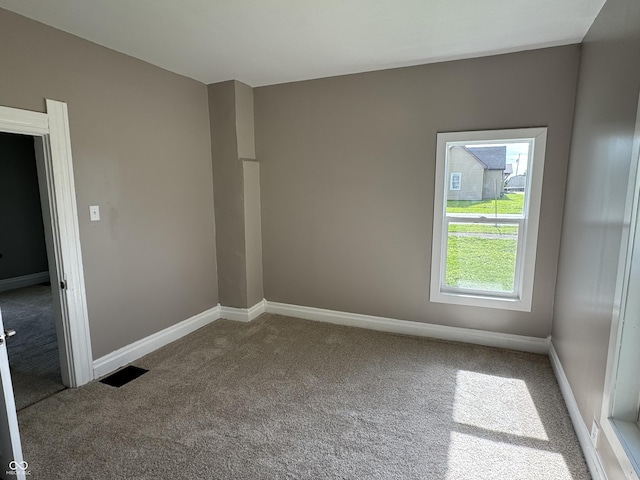 707 N Water St, Hillsboro, IN 47949 - empty room featuring carpet floors and baseboards