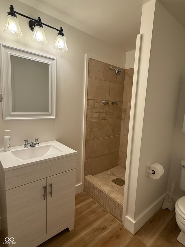 2346 N State Road 39, Danville, IN 46122 - full bath featuring wood finished floors, tiled shower, and vanity