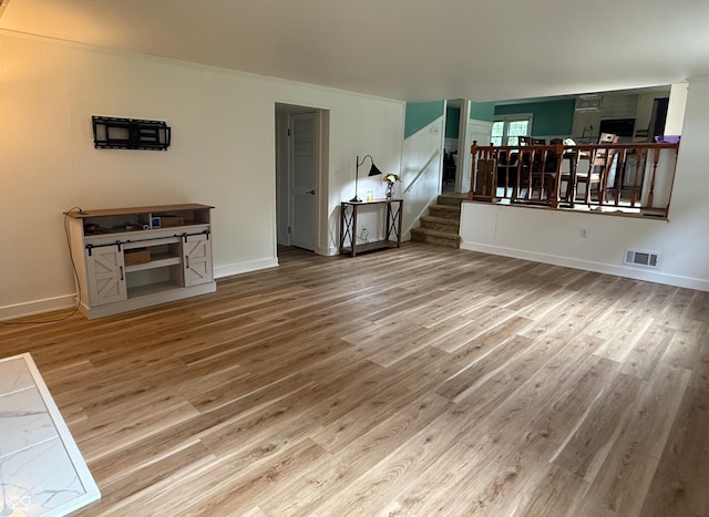 2346 N State Road 39, Danville, IN 46122 - unfurnished living room featuring wood finished floors and stairs