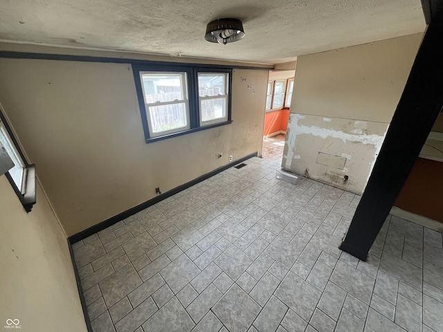 16 S 7th St, West Terre Haute, IN 47885 - unfurnished room with a textured ceiling and baseboards