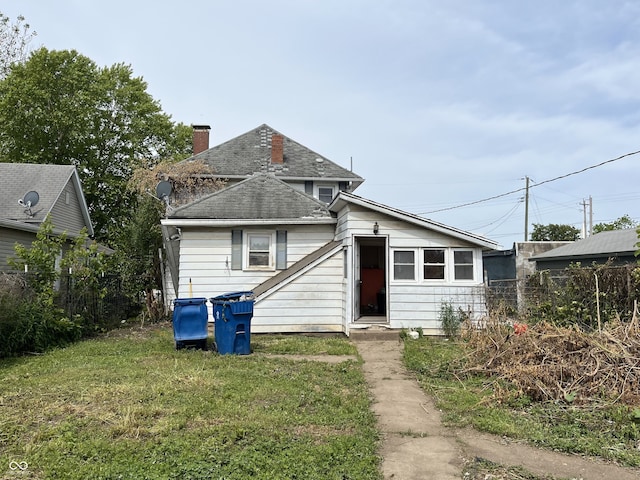 16 S 7th St, West Terre Haute, IN 47885 - view of front of home with a shingled roof and a chimney