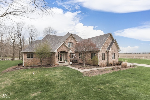 1344 S Fox Paw Dr, New Palestine, IN 46163 - view of front facade featuring a front lawn, brick siding, and roof with shingles