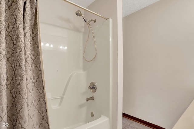 1344 S Fox Paw Dr, New Palestine, IN 46163 - full bathroom with tile patterned flooring, shower / bath combo, and a textured ceiling