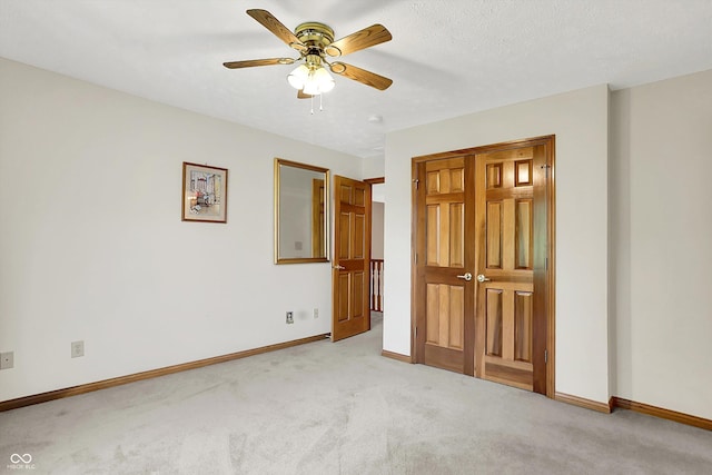 1344 S Fox Paw Dr, New Palestine, IN 46163 - unfurnished bedroom featuring light carpet and a ceiling fan