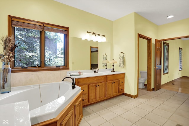1344 S Fox Paw Dr, New Palestine, IN 46163 - full bathroom featuring tile patterned flooring, a garden tub, and vanity