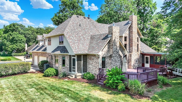 1344 S Fox Paw Dr, New Palestine, IN 46163 - view of front facade with a chimney, a garage, brick siding, a front lawn, and a deck