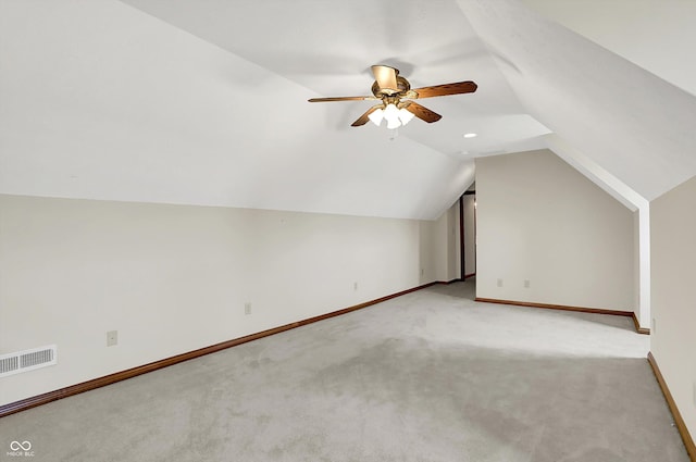 1344 S Fox Paw Dr, New Palestine, IN 46163 - additional living space featuring light carpet, ceiling fan, and vaulted ceiling