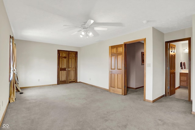 1344 S Fox Paw Dr, New Palestine, IN 46163 - unfurnished bedroom with light colored carpet, ceiling fan, and a closet
