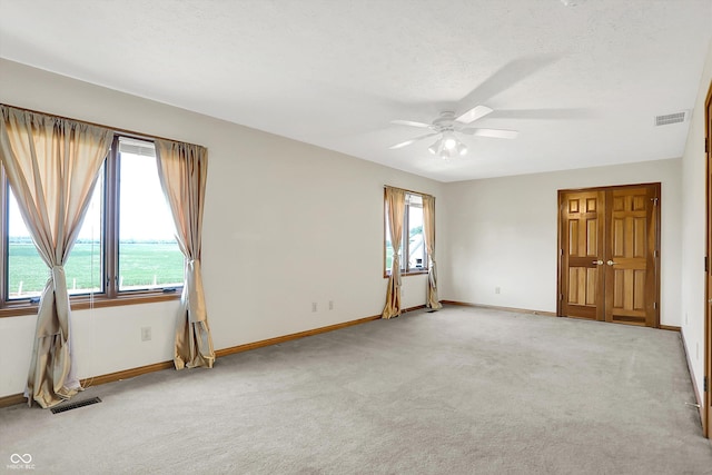 1344 S Fox Paw Dr, New Palestine, IN 46163 - carpeted empty room featuring baseboards and ceiling fan