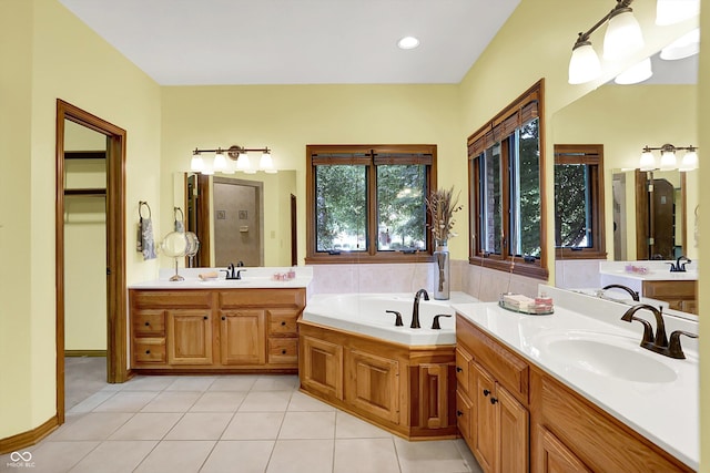 1344 S Fox Paw Dr, New Palestine, IN 46163 - full bath with tile patterned floors, two vanities, and a garden tub