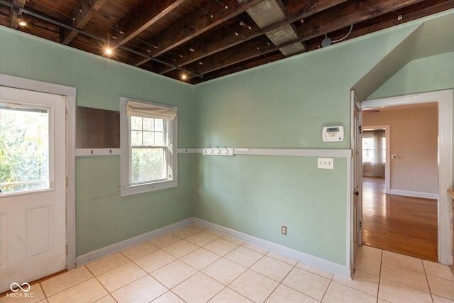 1015 Fairfield Ave, Indianapolis, IN 46205 - unfurnished room featuring light tile patterned floors, healthy amount of natural light, and baseboards