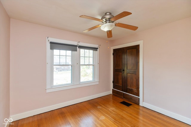 1015 Fairfield Ave, Indianapolis, IN 46205 - unfurnished bedroom with baseboards, wood finished floors, and ceiling fan