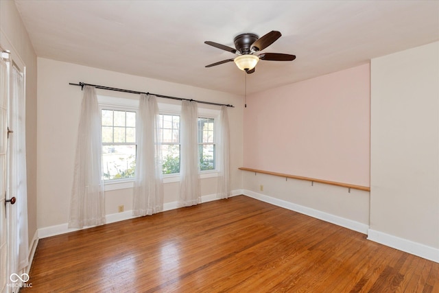 1015 Fairfield Ave, Indianapolis, IN 46205 - empty room with wood finished floors, baseboards, and ceiling fan