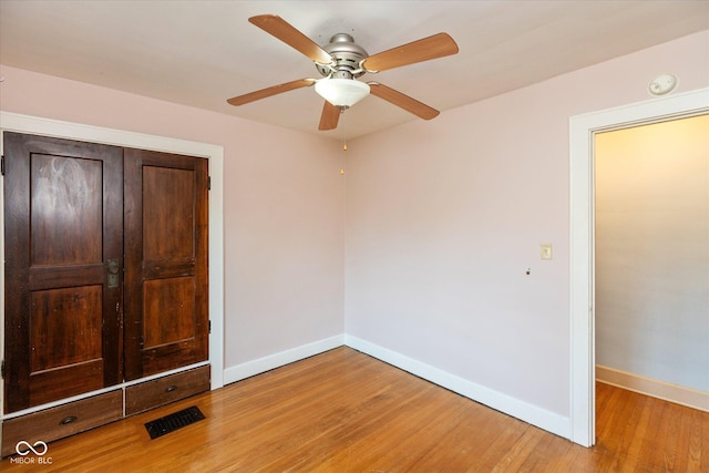1015 Fairfield Ave, Indianapolis, IN 46205 - unfurnished bedroom featuring baseboards, light wood-type flooring, a closet, and a ceiling fan
