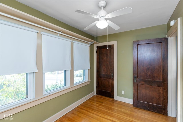 1015 Fairfield Ave, Indianapolis, IN 46205 - unfurnished bedroom with light wood-style flooring, baseboards, and a ceiling fan