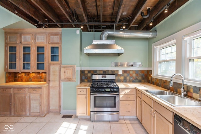 1015 Fairfield Ave, Indianapolis, IN 46205 - kitchen featuring gas stove, black dishwasher, a sink, and rail lighting