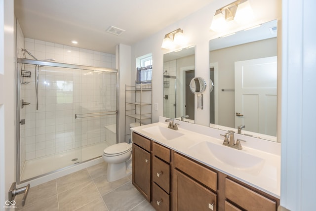 1863 River Birch Dr, Greenfield, IN 46140 - bathroom with a shower stall, tile patterned floors, toilet, and double vanity