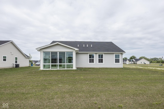 1863 River Birch Dr, Greenfield, IN 46140 - rear view of property with a lawn, central AC, a sunroom, and roof with shingles