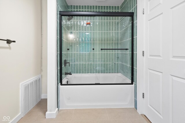 5422 Orange St, Indianapolis, IN 46203 - full bathroom featuring enclosed tub / shower combo, tile patterned floors, and baseboards