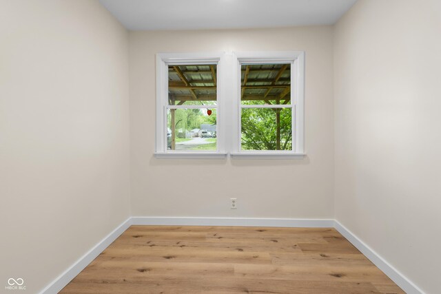 5422 Orange St, Indianapolis, IN 46203 - empty room with baseboards and light wood finished floors