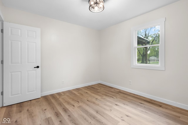 5422 Orange St, Indianapolis, IN 46203 - empty room featuring baseboards and wood finished floors