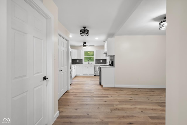 5422 Orange St, Indianapolis, IN 46203 - kitchen featuring stainless steel appliances, white cabinets, backsplash, a ceiling fan, and recessed lighting