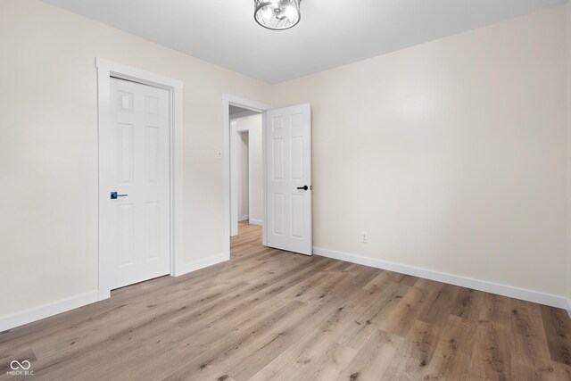 5422 Orange St, Indianapolis, IN 46203 - empty room with baseboards and wood finished floors