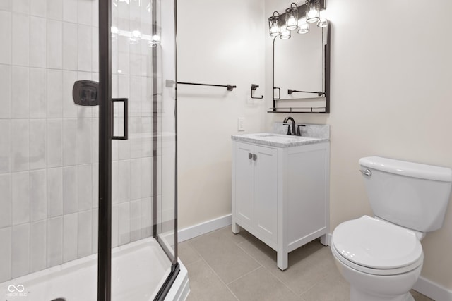 5422 Orange St, Indianapolis, IN 46203 - bathroom featuring toilet, a shower stall, vanity, tile patterned floors, and baseboards