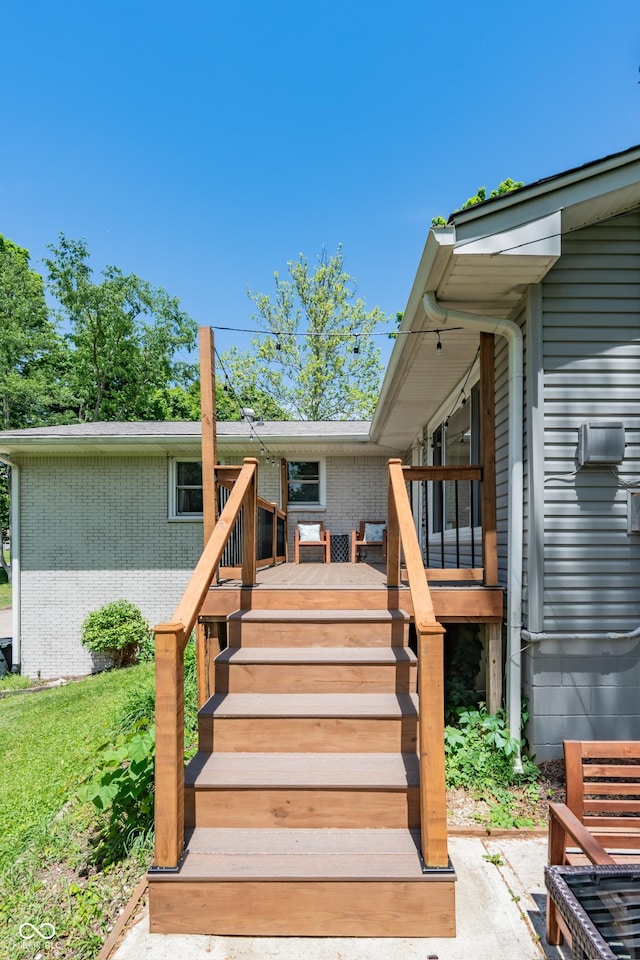 6799 Lakeshore Dr, Avon, IN 46123 - property entrance featuring a wooden deck and brick siding