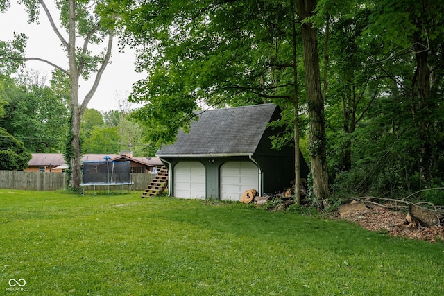 6799 Lakeshore Dr, Avon, IN 46123 - view of yard with a trampoline, an outbuilding, and a detached garage