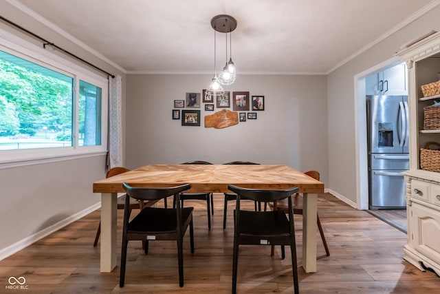 6799 Lakeshore Dr, Avon, IN 46123 - dining area with ornamental molding, light wood-style flooring, and baseboards
