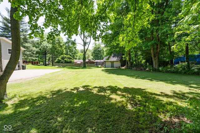 6799 Lakeshore Dr, Avon, IN 46123 - view of yard featuring an outdoor structure and view of scattered trees